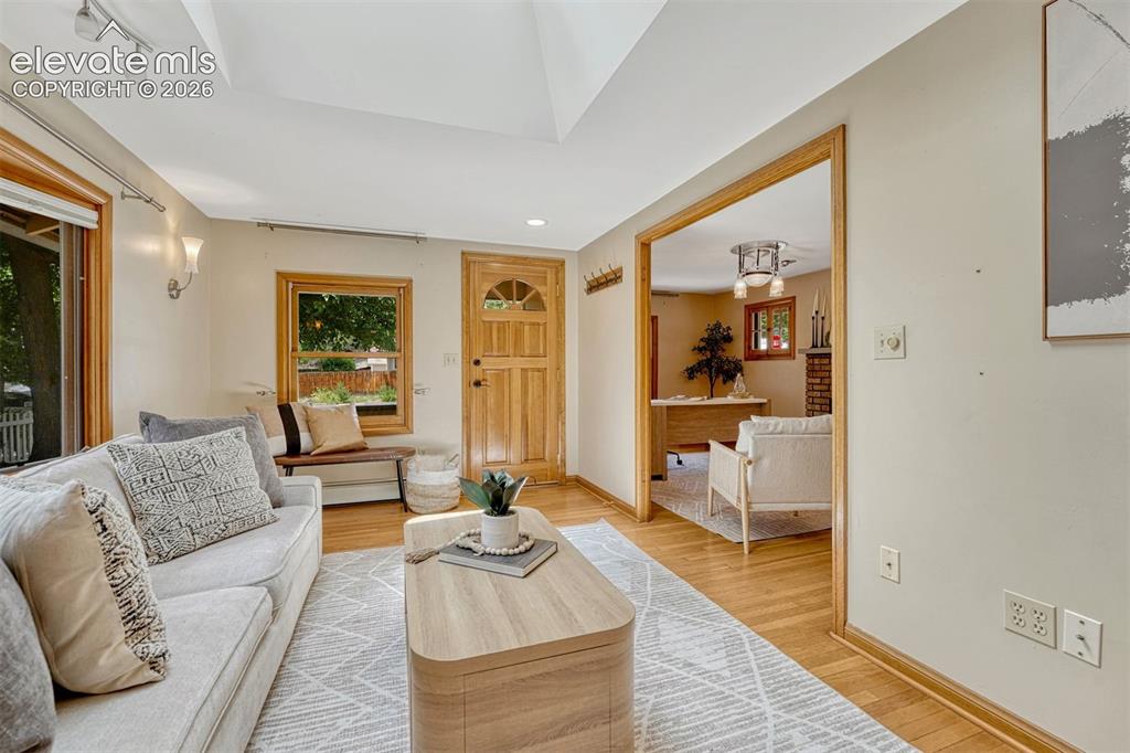 Image 17 of 42: Beautifut oak wood floors and natural light throughout