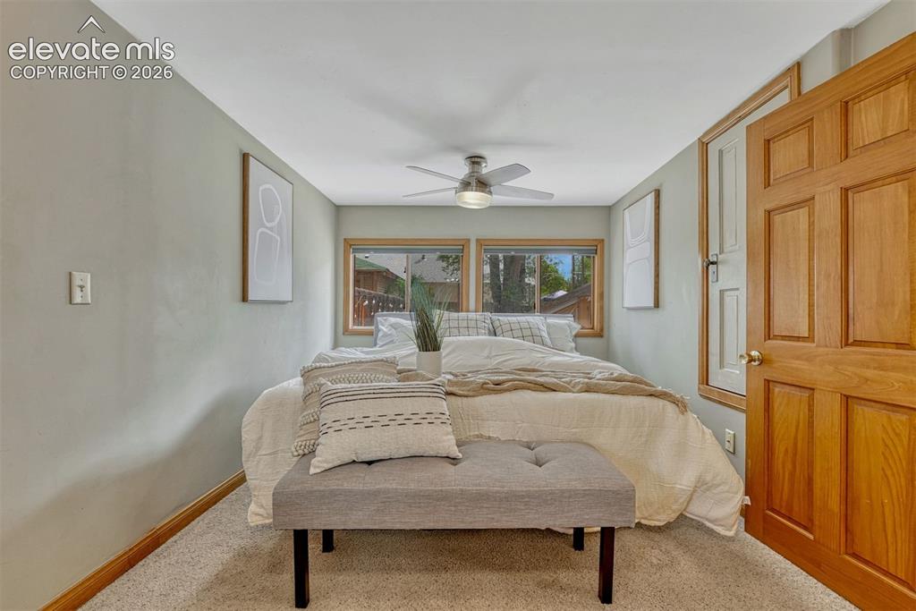 Image 21 of 42: Ceiling fan and blackout blinds