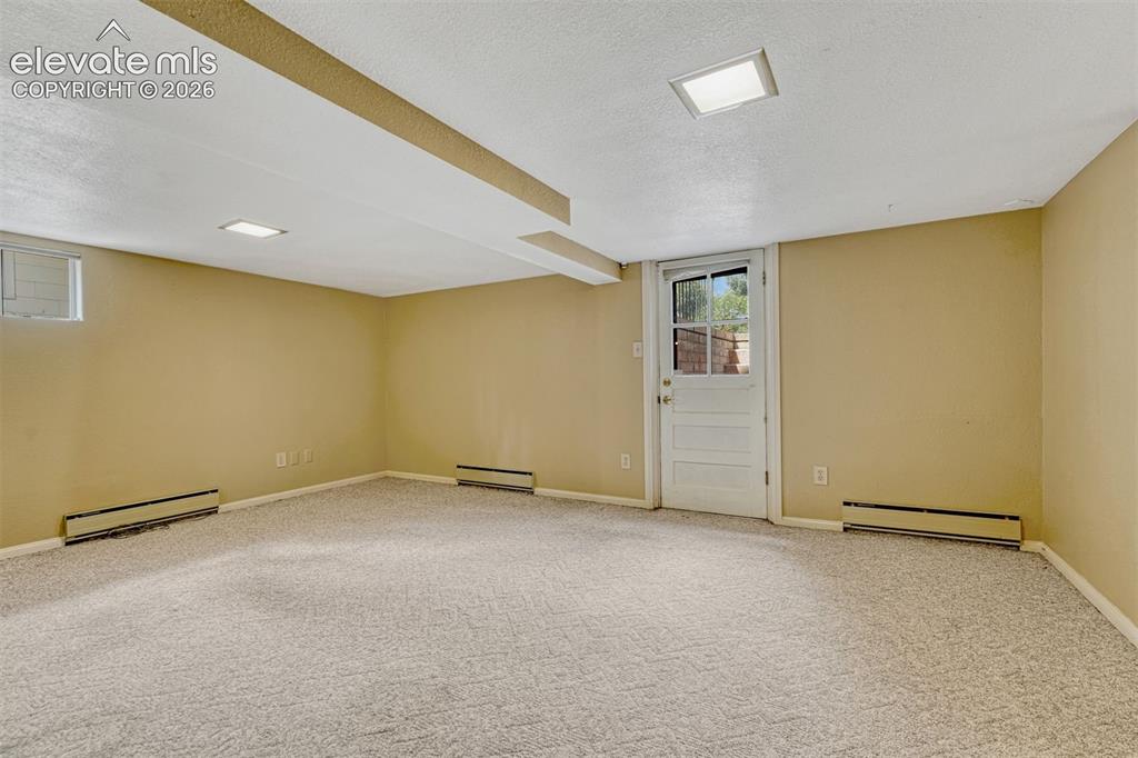 Image 32 of 42: Bedroom 2 has exterior access - walkout