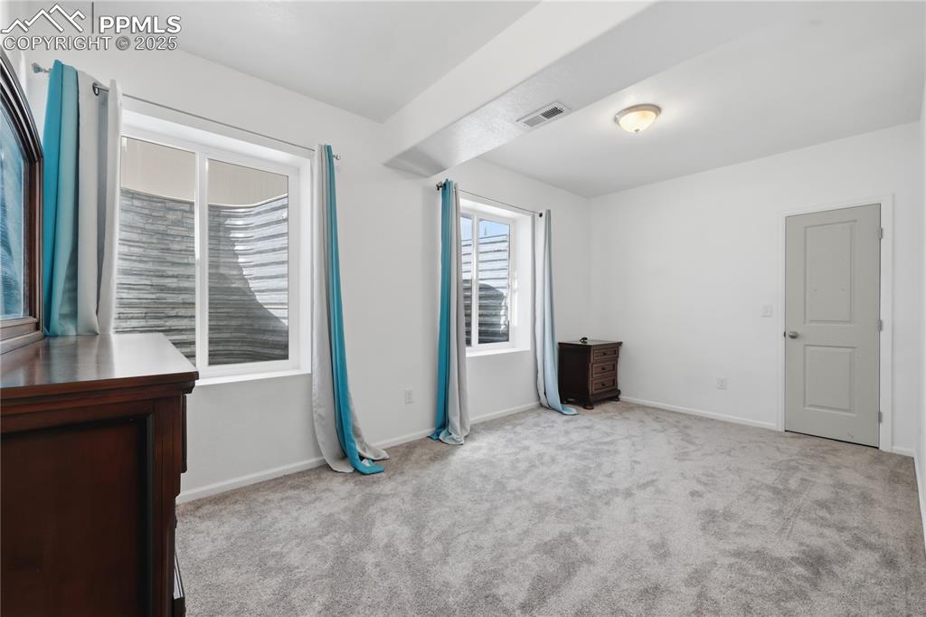 Image 19 of 37: Unfurnished bedroom featuring light colored carpet and baseboards
