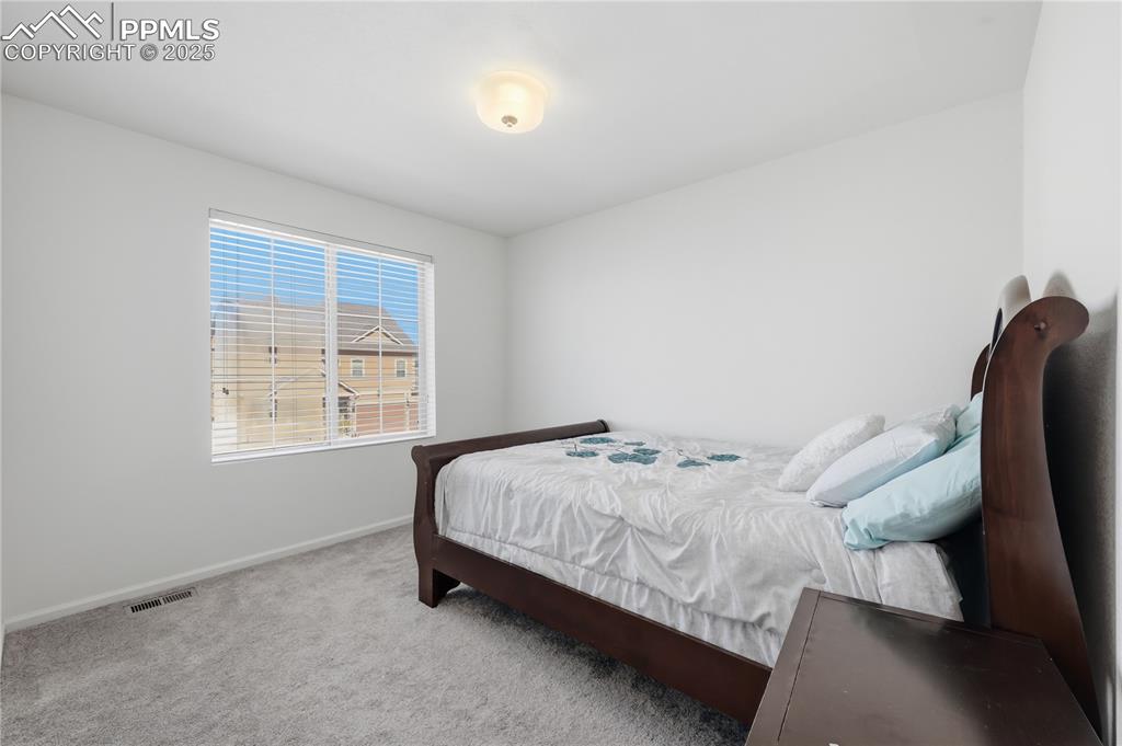 Image 25 of 37: Bedroom with carpet and baseboards