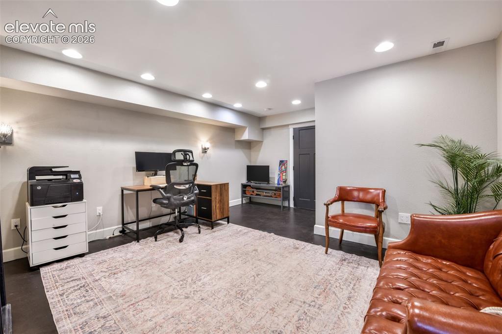 Image 38 of 50: Large Basement bedroom with living/office area