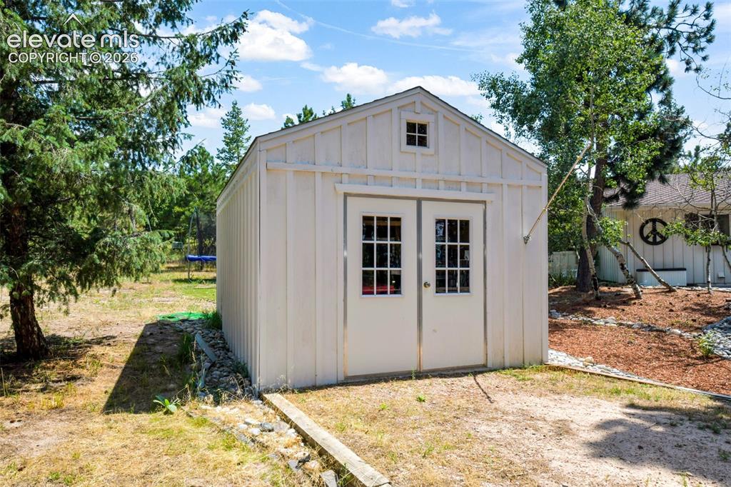 Image 41 of 50: Large Shed with extra parking