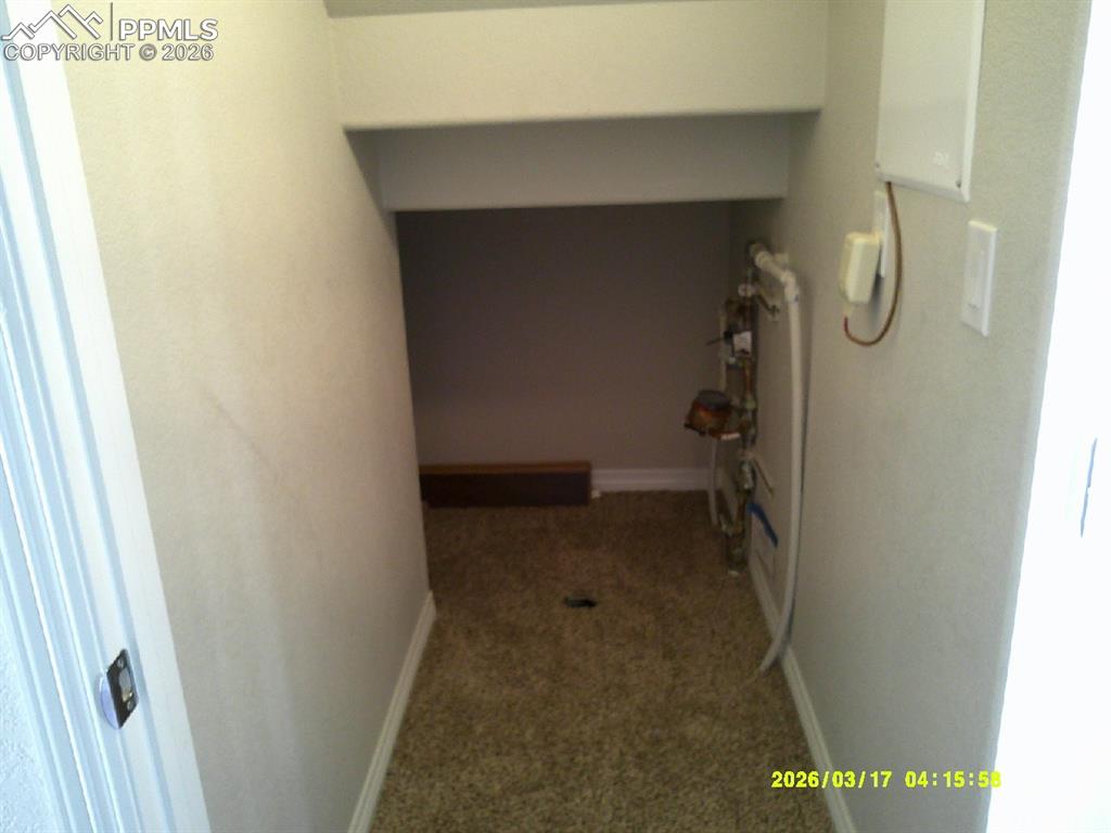 Image 10 of 16: Hallway featuring carpet and baseboards