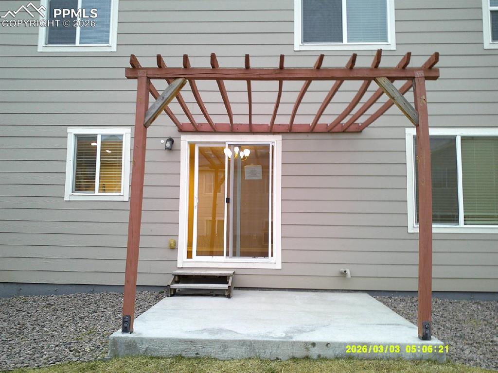 Image 14 of 16: Property entrance featuring a patio