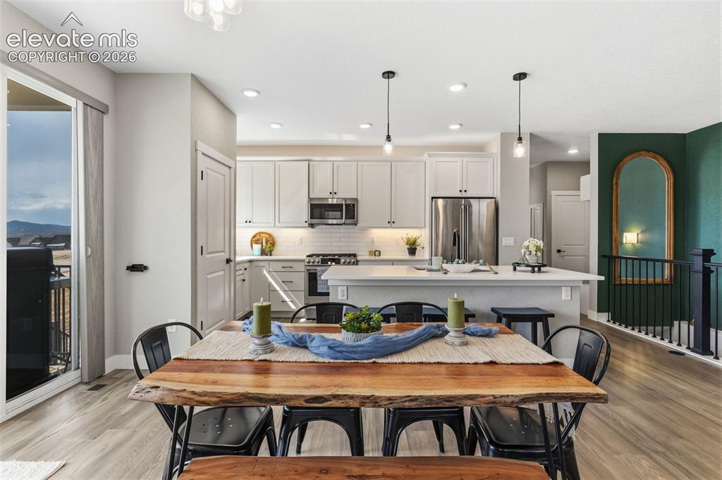 Image 14 of 46: Dining area with seamless indoor/outdoor flow