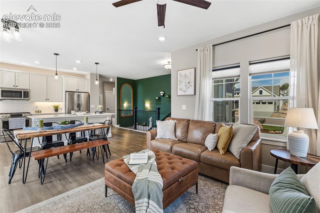Image 15 of 46: Hallway on the right leads to garage access, full bath and 2 bedrooms