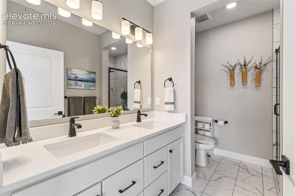 Image 19 of 46: Primary bedroom w/ windows that let you see that picturesque mountain view