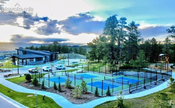 Image 35 of 41: Home Place Ranch Community Center, pickleball/tennis courts and playground