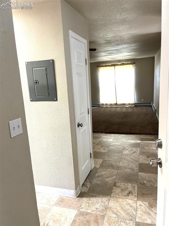 Image 18 of 28: view from front door to living area