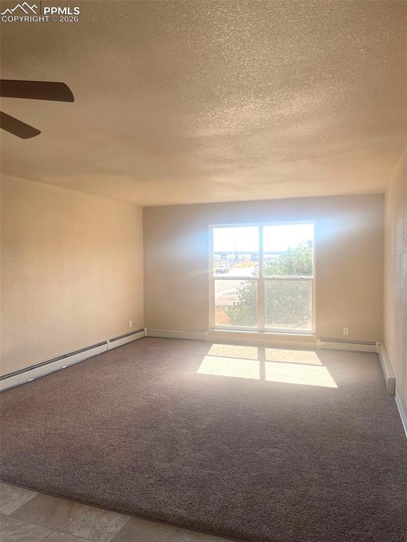 Image 2 of 28: view from dining area to living room with large window