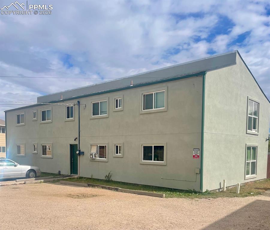 Image 7 of 28: rear of structure, newer roof