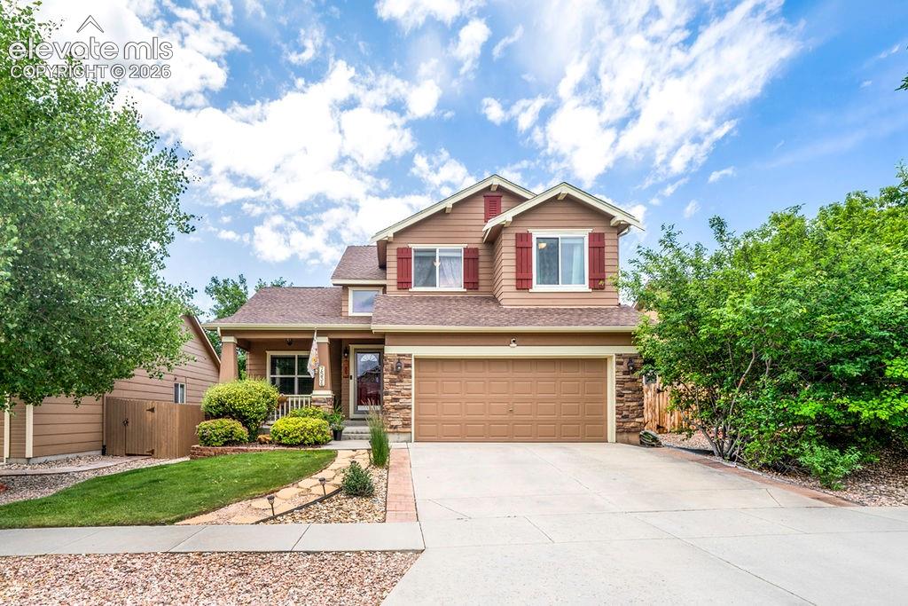 Image 2 of 44: Boasting outstanding curb appeal, this home is beautifully framed by meticu