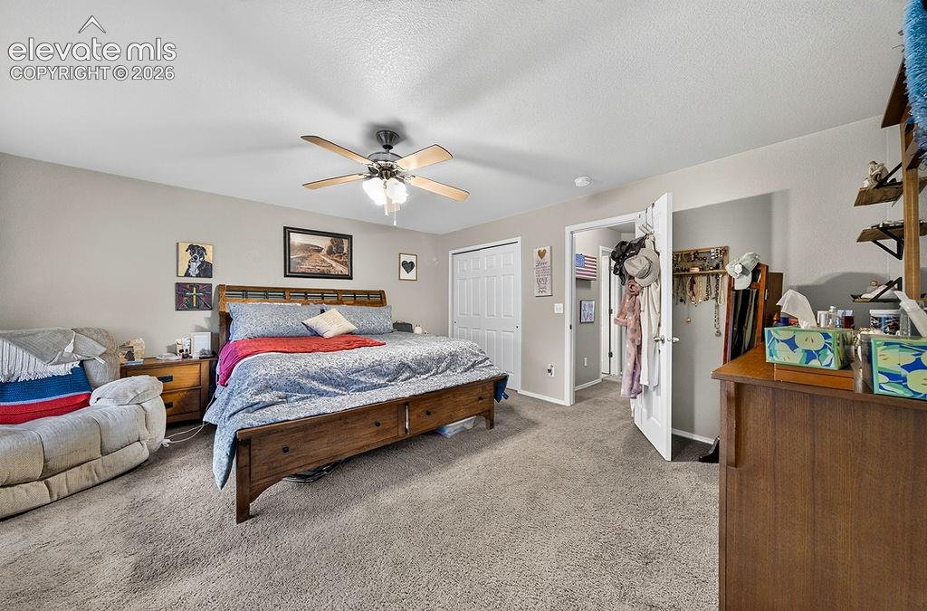 Image 23 of 44: The upper level Primary Bedroom offers room for a sitting area and double c
