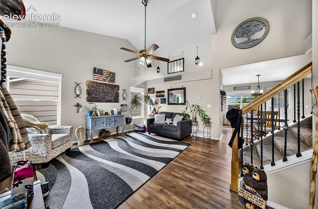 Image 3 of 44: The living room boasts vaulted ceilings creating an inviting, open atmosphe