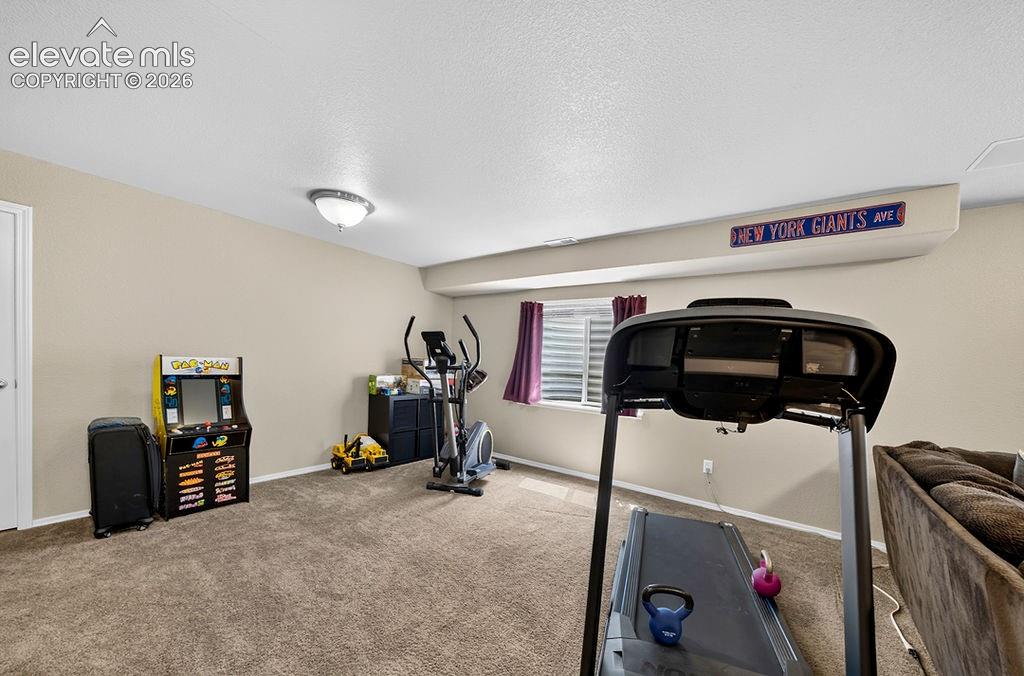 Image 34 of 44: Current gym area of the Basement Family Room.