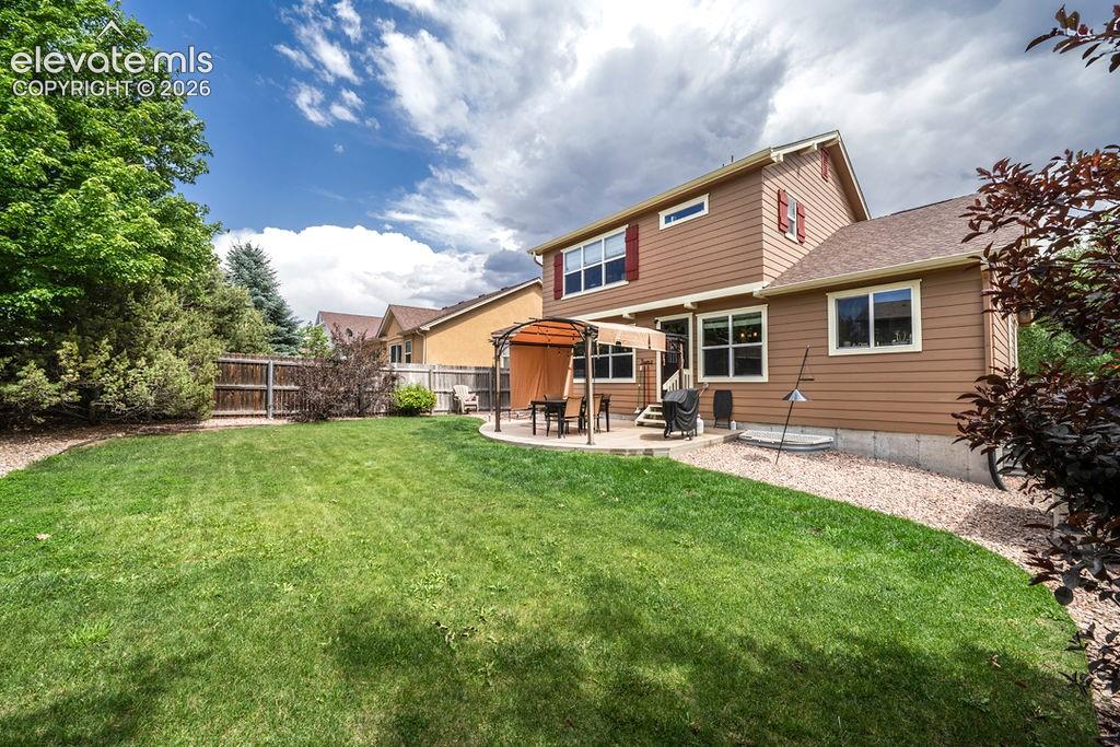 Image 41 of 44: Large grassy area for the kids and pets to play.