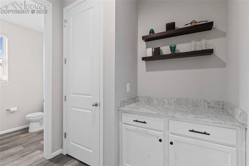 Image 14 of 44: Bathroom featuring light wood-style floors and vanity