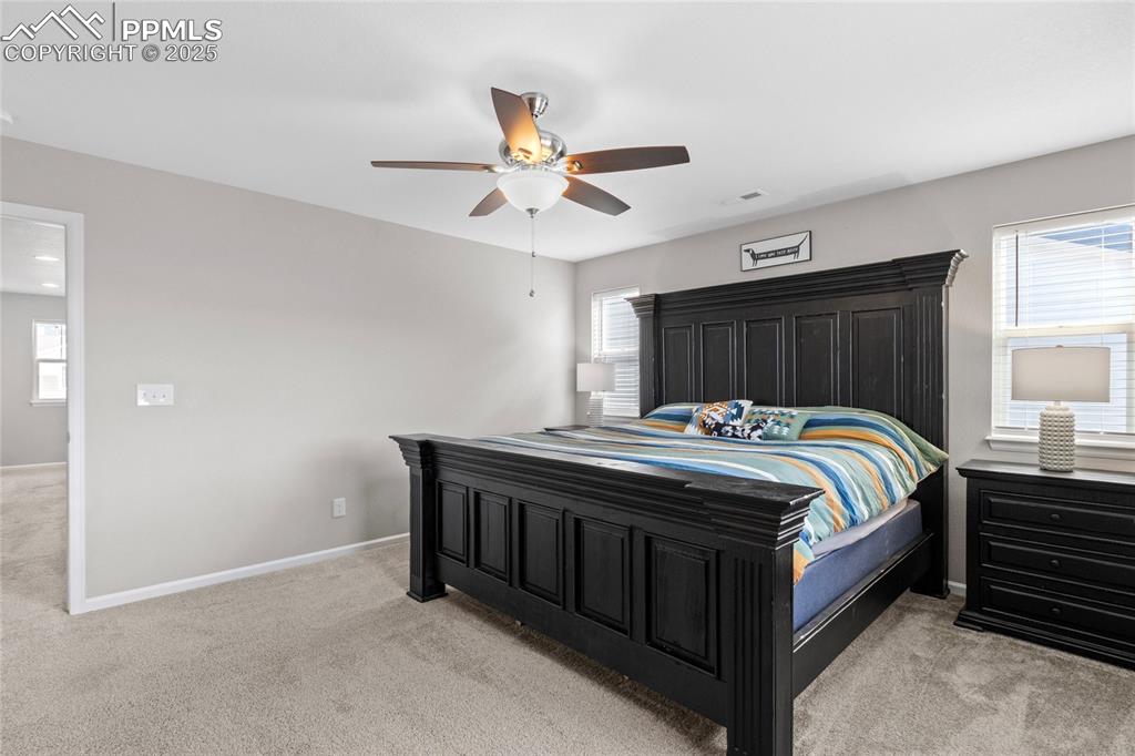 Image 20 of 44: Bedroom featuring light carpet and ceiling fan