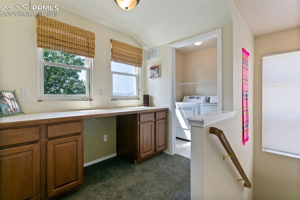 Image 12 of 29: Laundry area, craft space or office area in loft