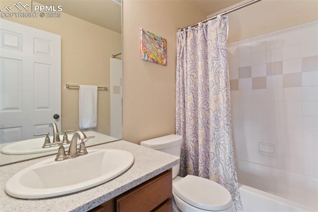 Image 20 of 29: Bathroom featuring vanity, shower / bath combo