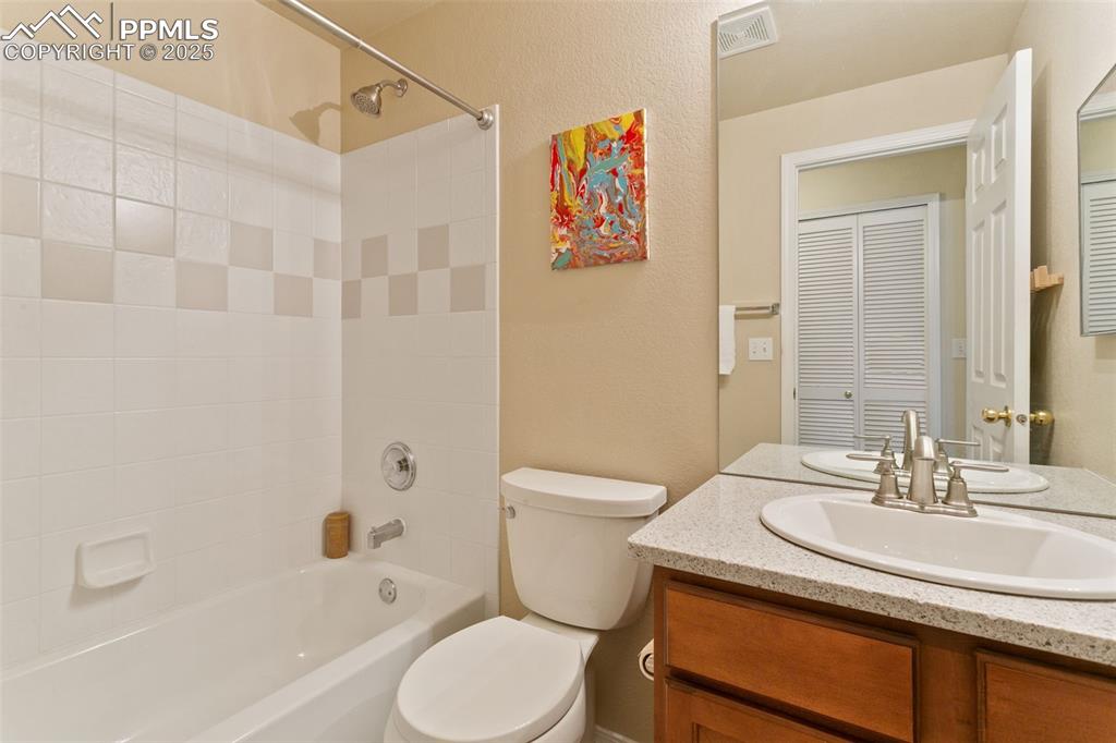 Image 25 of 29: Basement bathroom featuring bath/shower combination, and vanity