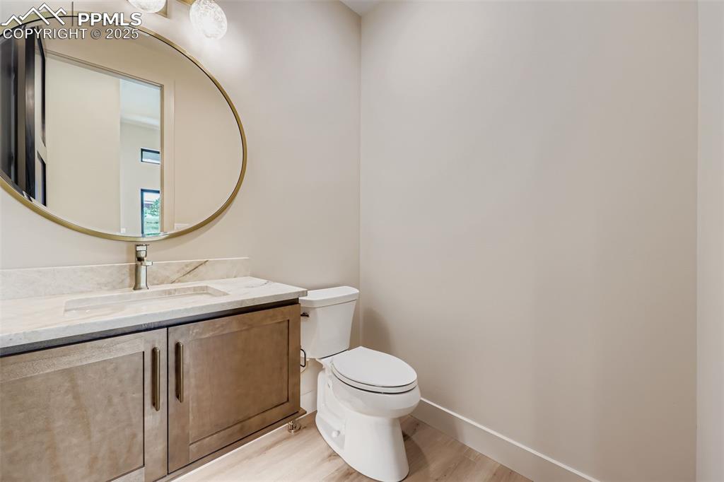 Image 11 of 41: Bathroom with vanity and light wood-style floors