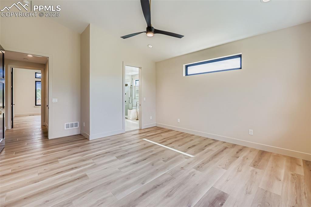 Image 13 of 41: Unfurnished bedroom featuring light wood-style flooring, ceiling fan, reces