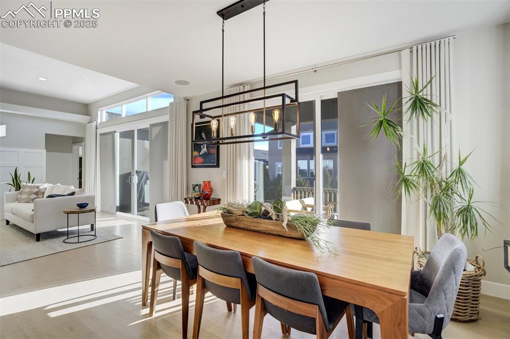 Image 11 of 50: One set of patio doors off dining room leads to covered patio