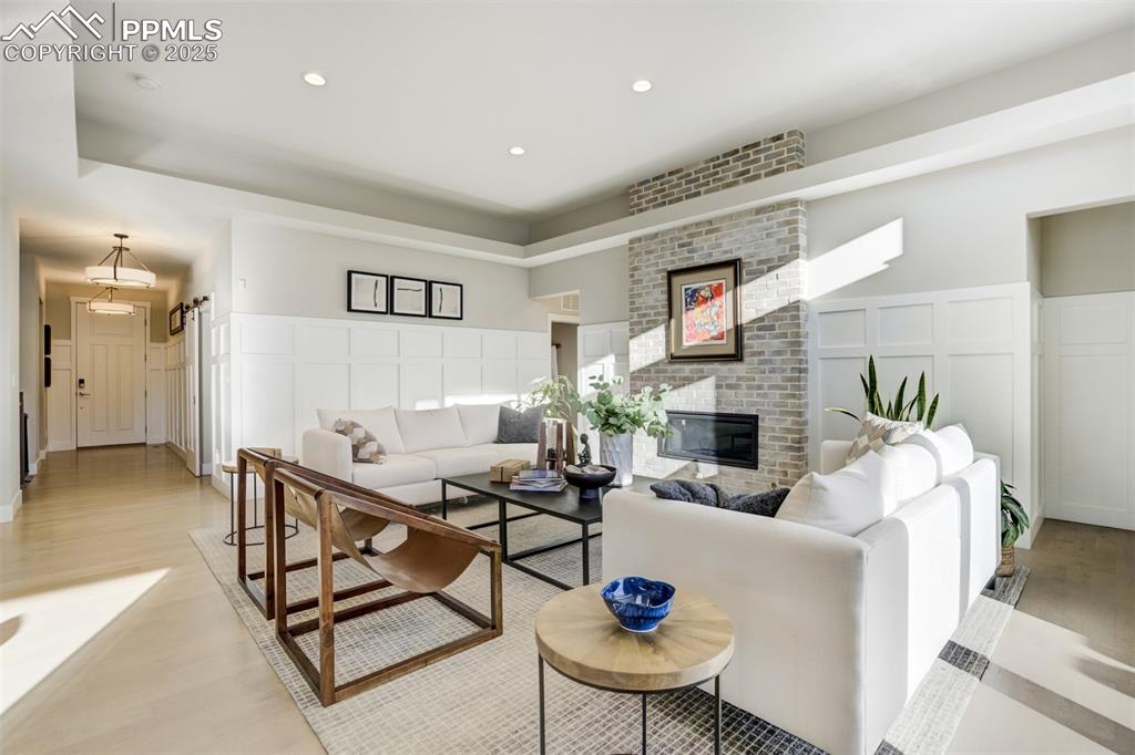 Image 14 of 50: Charming and inviting living room provides a perfect space to gather