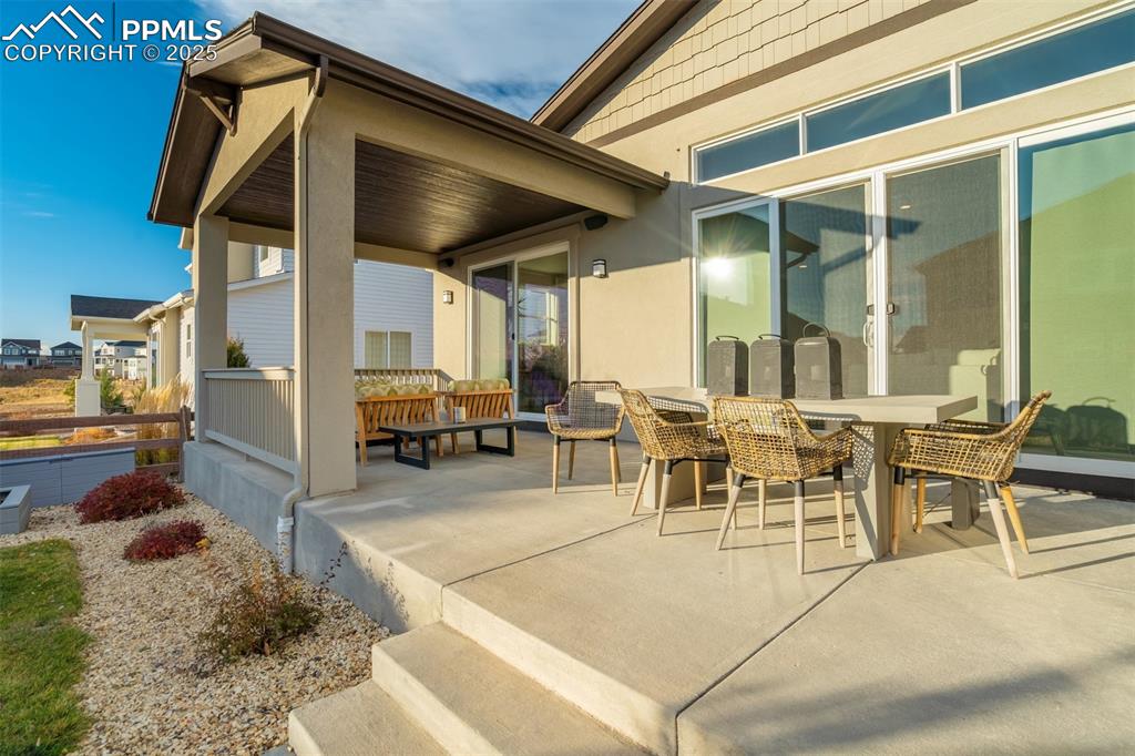 Image 16 of 50: Two sliding doors from main living area to patio; one is extended