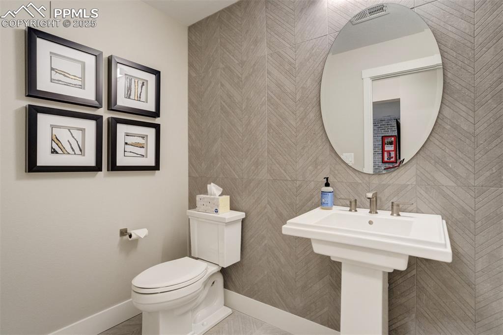 Image 27 of 50: Half bath on lower level