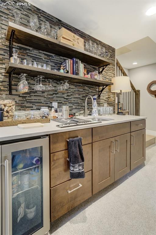 Image 33 of 50: Custom bar with floating shelves