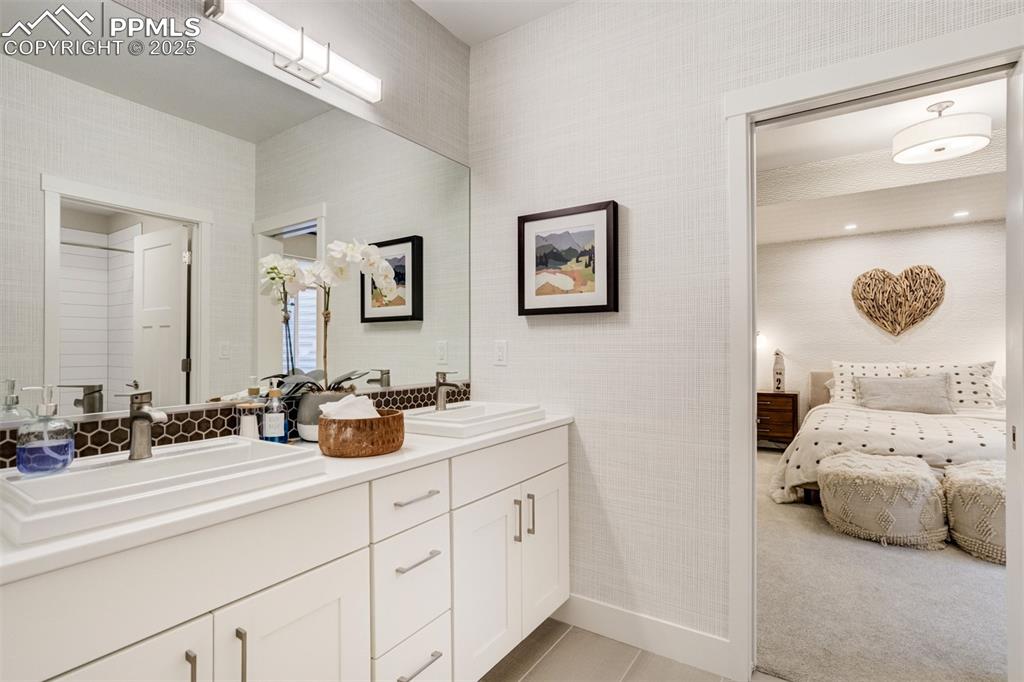 Image 37 of 50: Full bathroom off bedroom #3 in basement