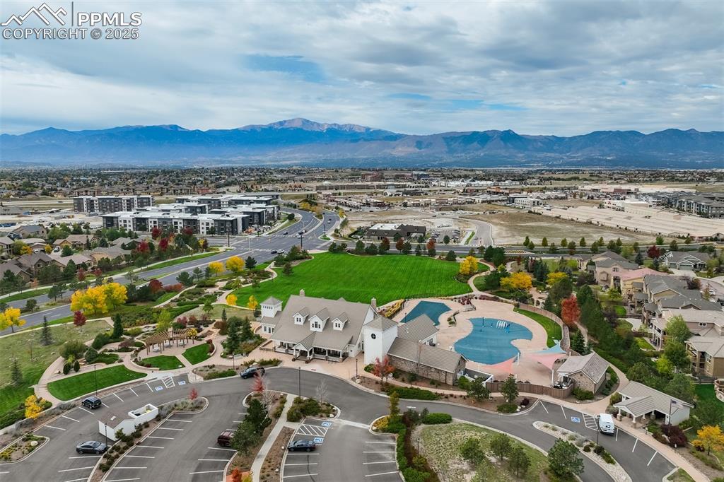 Image 49 of 50: Community center, pool, and splash pad