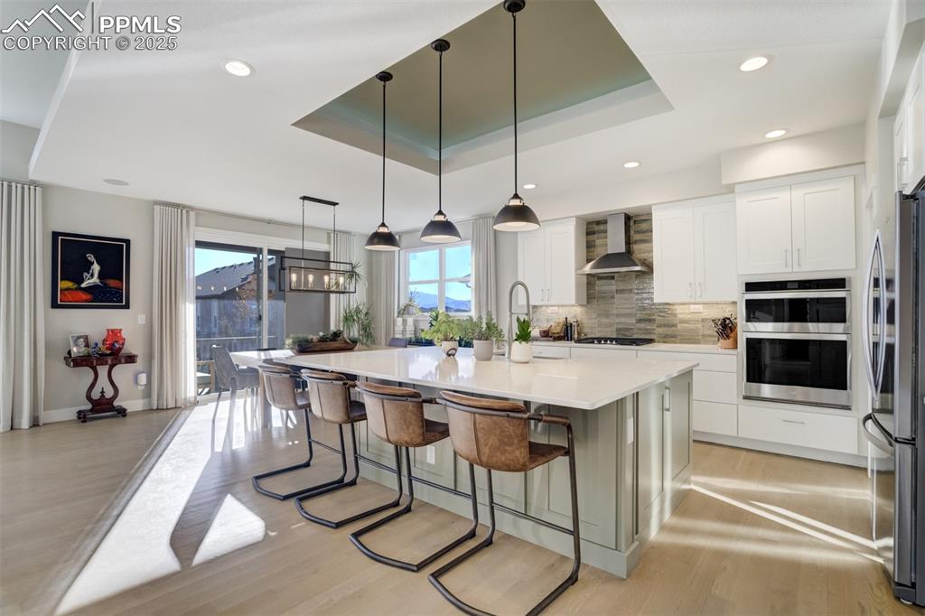 Image 5 of 50: Gourmet kitchen with oversized center island with seating
