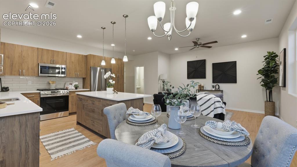 Image 14 of 50: Stainless steel appliances include a dishwasher, gas range oven, microwave,