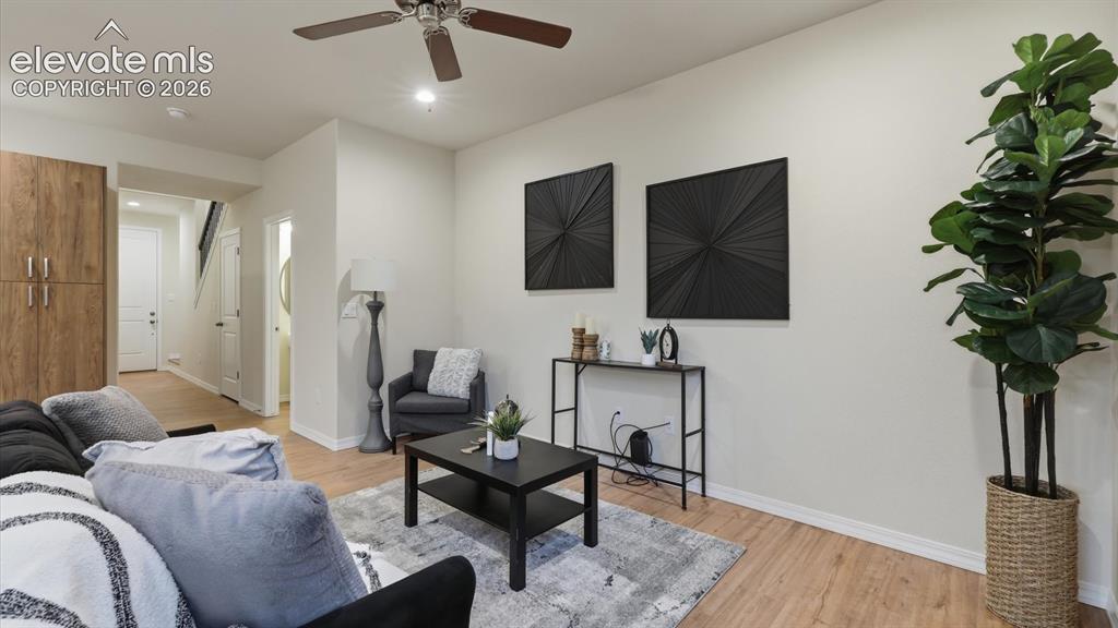 Image 17 of 50: View of the Living Room and Dining Area from the Kitchen.