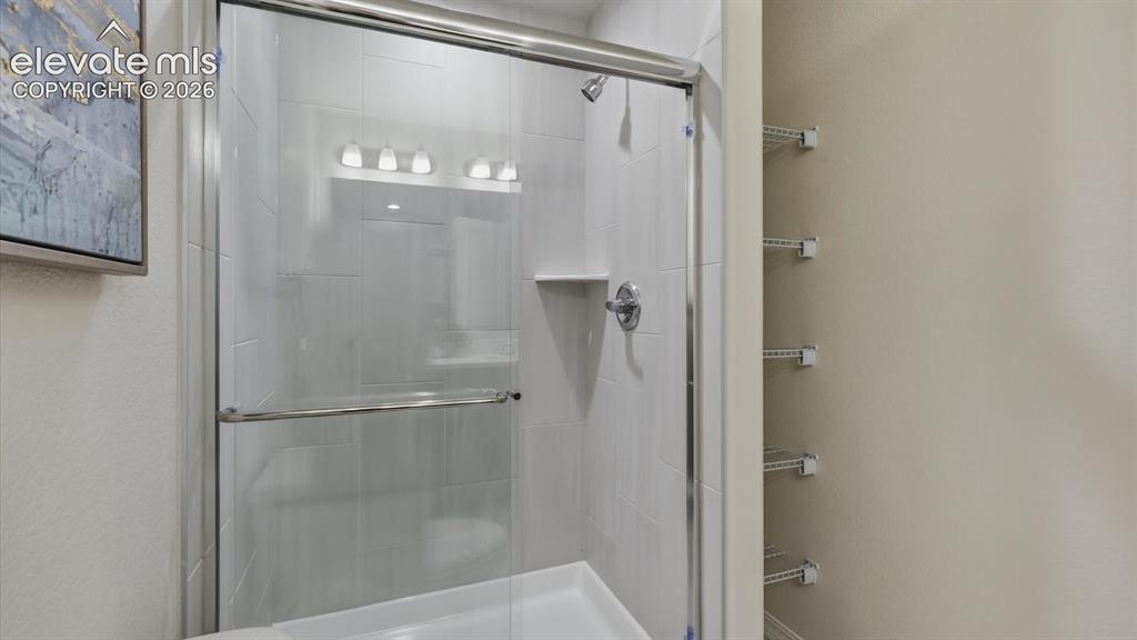 Image 24 of 50: Primary Bathroom - dual sink vanity with quartz countertops and large mirro