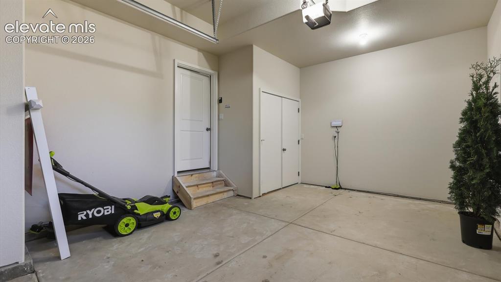 Image 32 of 50: Convenient upper level Laundry Area with front loading Samsung washer and d