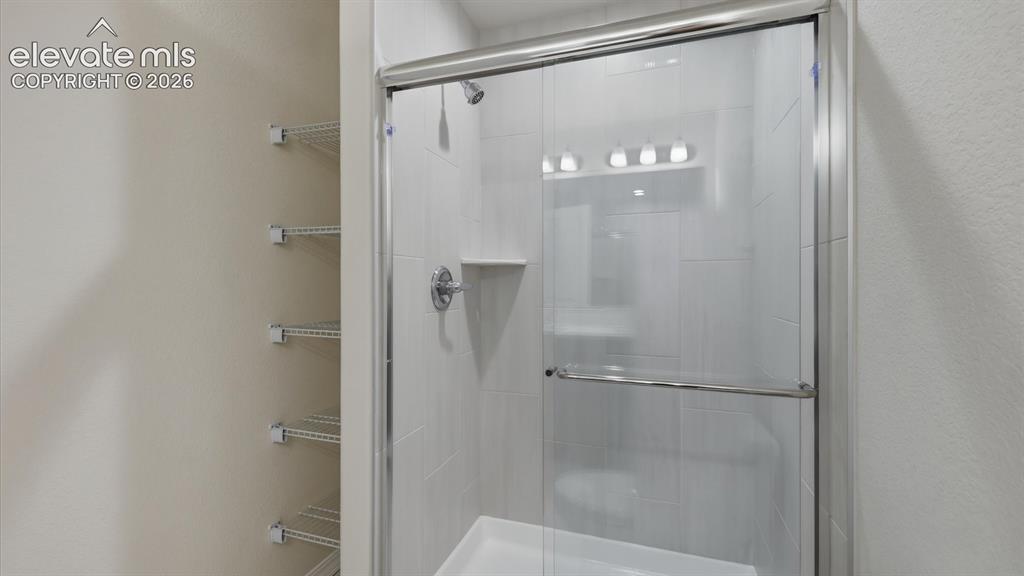 Image 48 of 50: Upper Level Primary Bathroom with dual sink vanity and mirror in the 2nd pr