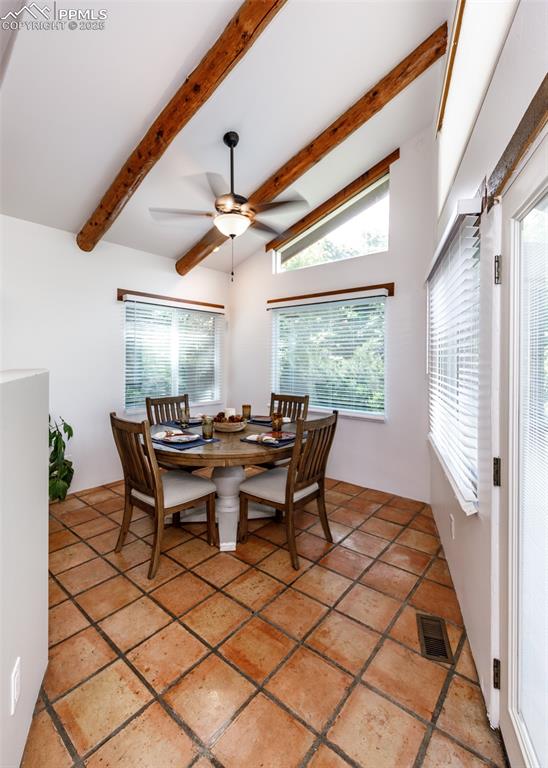 Image 18 of 50: Dining room featuring healthy amount of natural light and ceiling fan