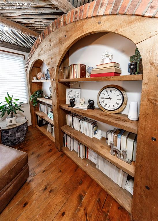 Image 20 of 50: Living area with dark wood-type flooring