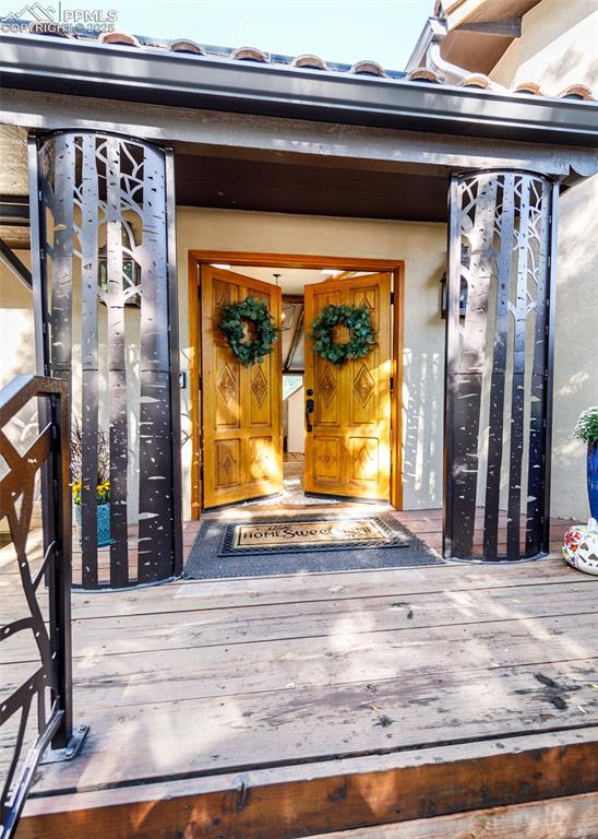Image 3 of 50: Doorway to property with stucco siding