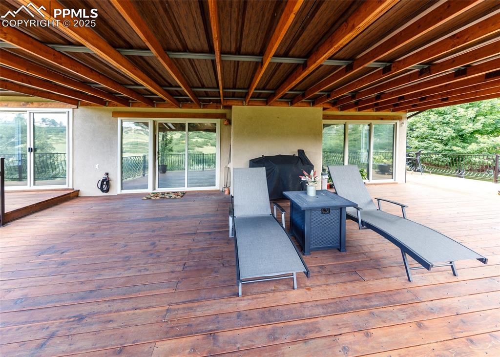 Image 50 of 50: Wooden deck with a grill