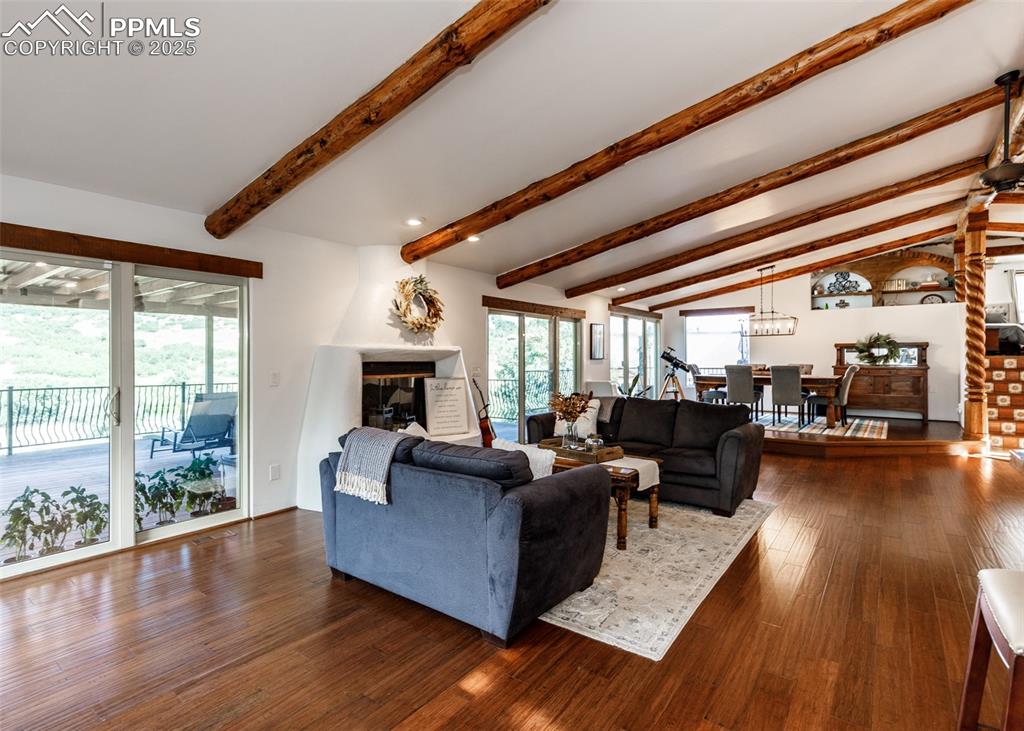Image 9 of 50: Living area featuring dark wood finished floors