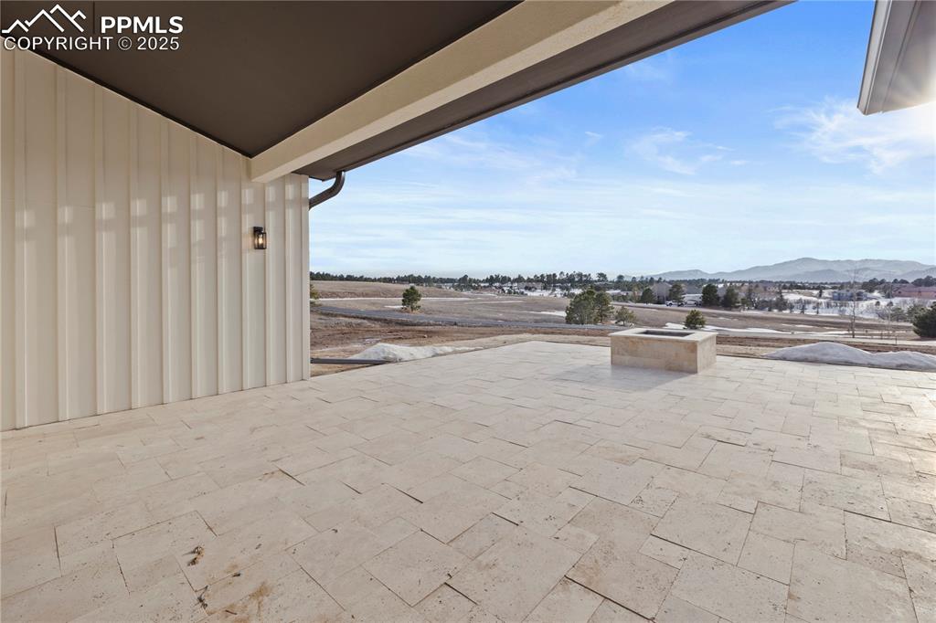 Image 11 of 47: View of patio / terrace with a mountain view
