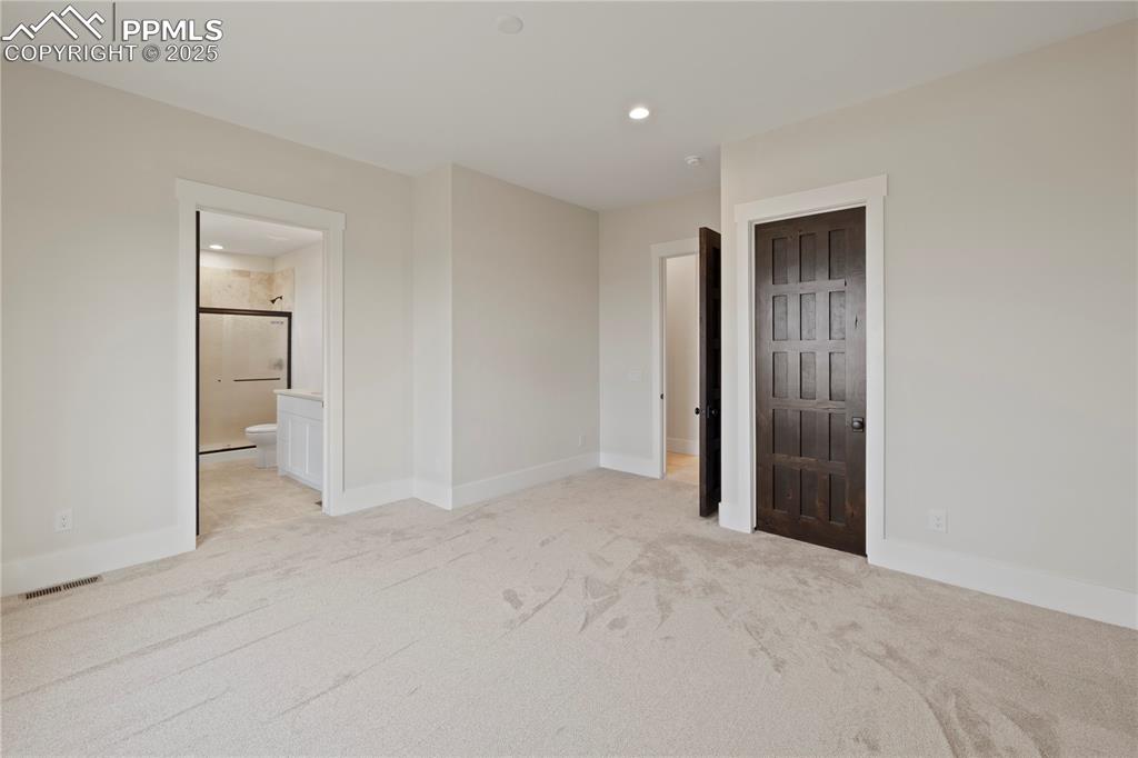 Image 40 of 47: Unfurnished bedroom with visible vents, baseboards, connected bathroom, rec