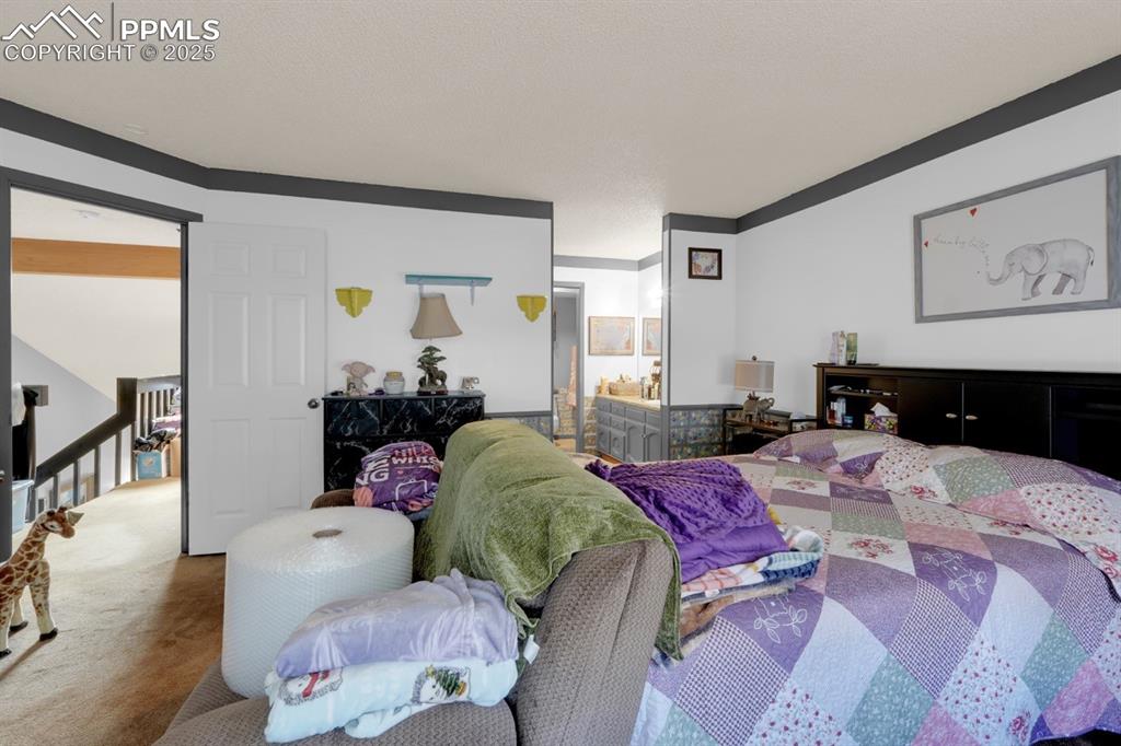 Image 16 of 27: Master Bedroom with En-Suite Bathroom
