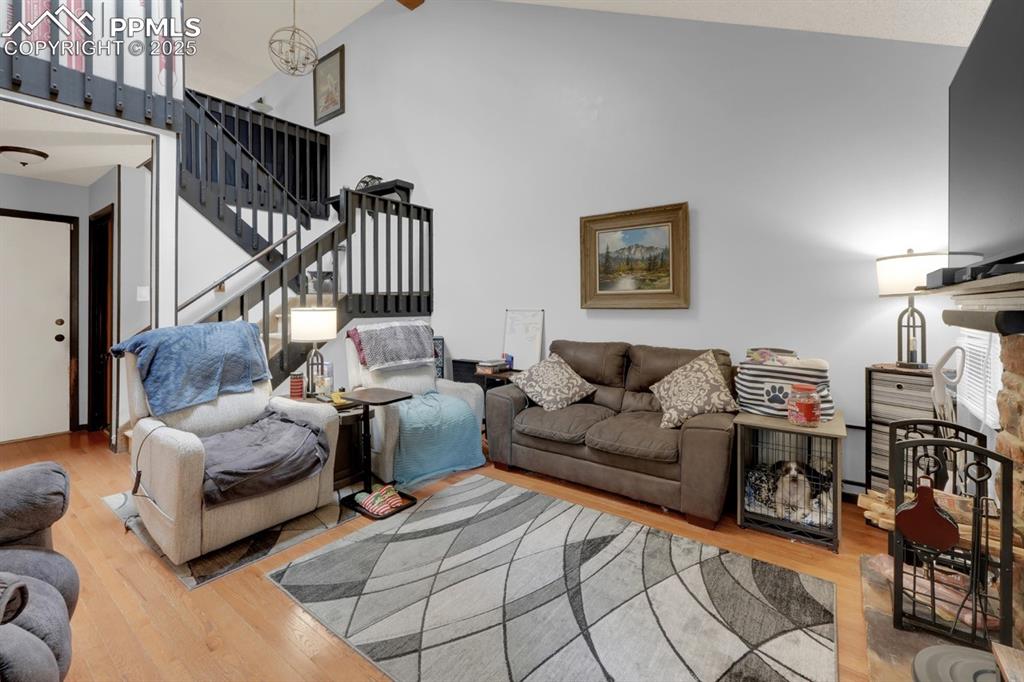 Image 6 of 27: Living area open to upper loft space